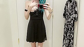 skinny gothic girl taking a selfie at hudson bay dressing room